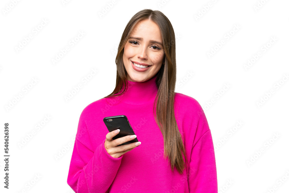 Young beautiful caucasian woman over isolated background using mobile phone Young beautiful caucasian woman over isolated background using mobile phone