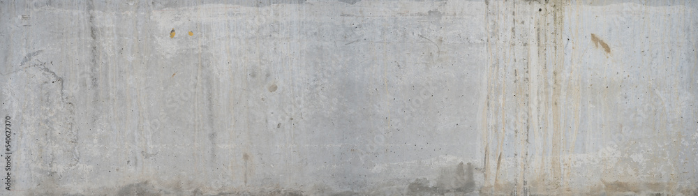 White gray exposed concrete wall - cement texture background banner panorama with efflorescence and rust spots weathered grunge pattern