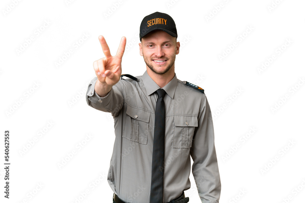 Young security caucasian man over isolated background smiling and showing victory sign Young security caucasian man over isolated background smiling and showing victory sign