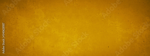 Abstract yellow golden colored spotted stone concrete texture wall wallpaper tiles background banner panorama, long pattern backgrounds.