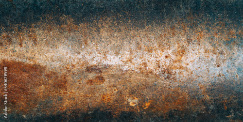 Rusty surface. Metal tube. Corrosion texture. Grunge old metallic pipe with orange damage spots copy space for text logo.