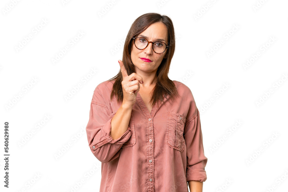 Middle-aged caucasian woman over isolated background frustrated and pointing to the front