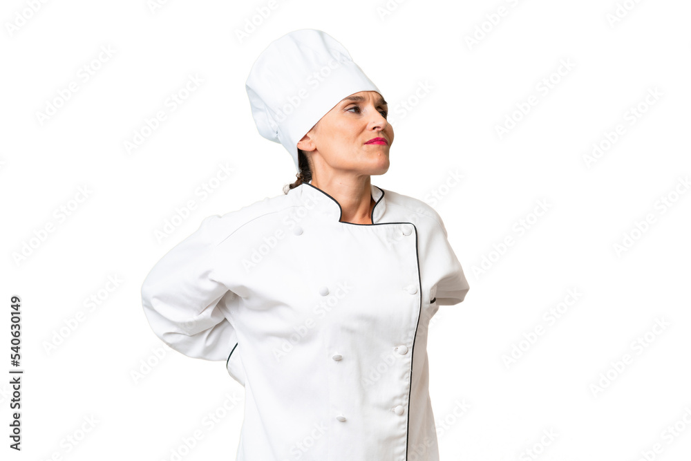 Middle-aged chef woman over isolated background suffering from backache for having made an effort Middle-aged chef woman over isolated background suffering from backache for having made an effort