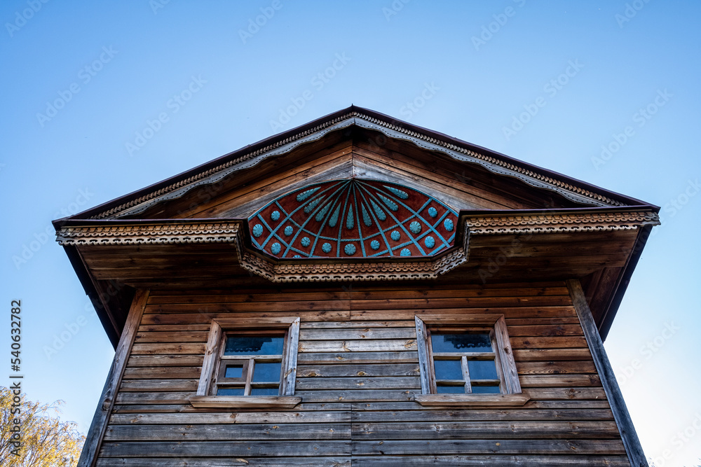 ancient wooden buildings as wonders of wooden architecture against the backdrop of autumn nature in Suzdal
