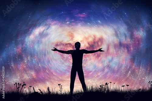 Happy man uniting with universe. Night sky with spiral nebula and stars.