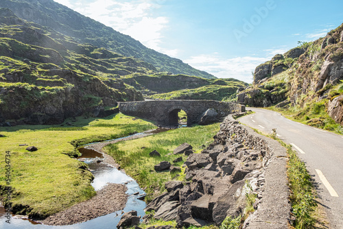 Wishing Bridge in green valley, Gap of Dunloe in Black Valley, Ring of Kerry, County Kerry, Ireland photo