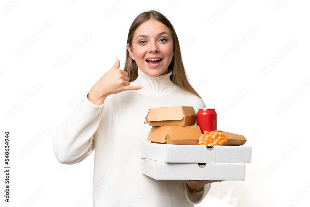 Young beautiful blonde woman holding takeaway food over isolated background making phone gesture. Call me back sign Young beautiful blonde woman holding takeaway food over isolated background making phone gesture. Call me back sign