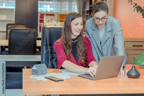 Wallpaper Mural Finance,accounting,Businesswomen analyzing investment charts with calculator laptop calculate technology in office, marketing business analysis data concept Torontodigital.ca