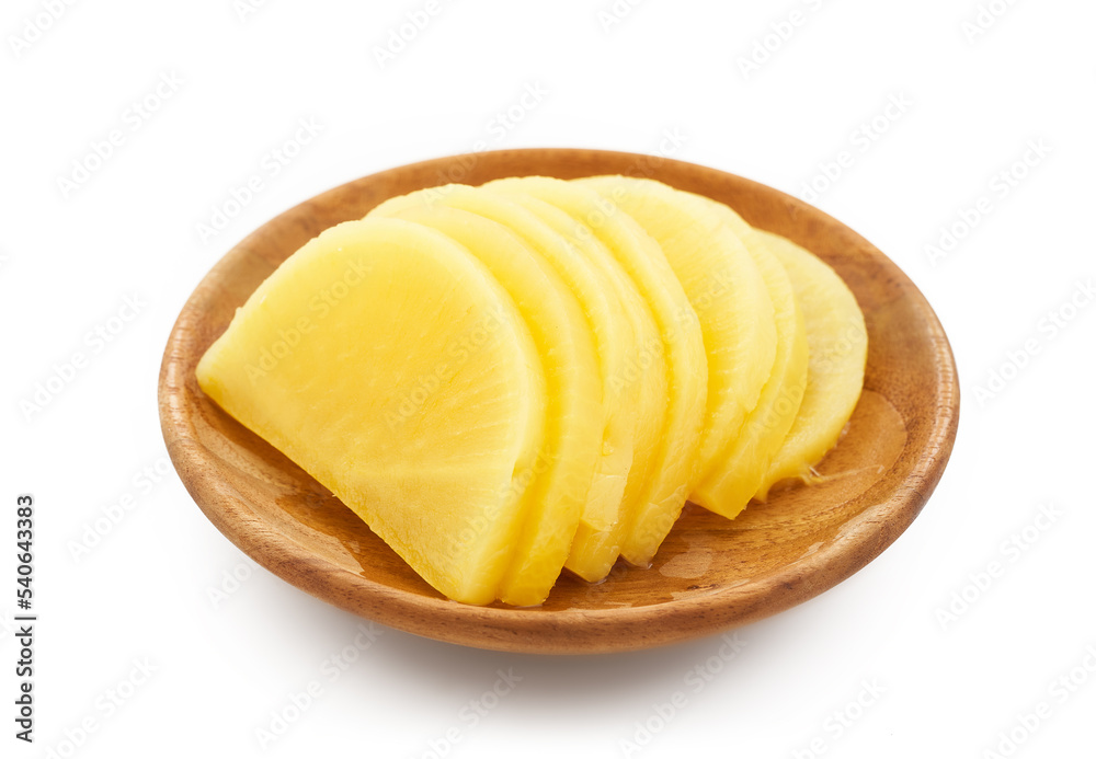 Korean yellow pickled radish or Danmuji side dish in wood bowl isolated on white background. yellow pickled radish or Danmuji side dish Korean yellow pickled radish or Danmuji side dish in wood bowl isolated on white background. yellow pickled radish or Danmuji side dish