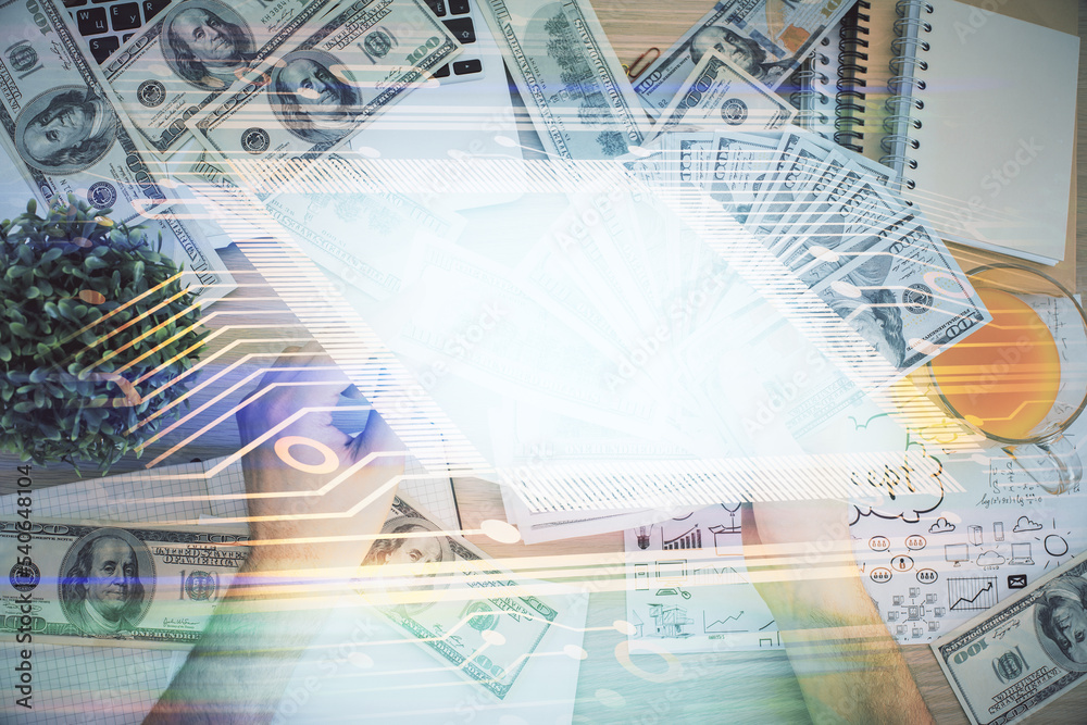 Multi exposure of technology drawing hologram and us dollars bills and man hands. Data concept Multi exposure of technology drawing hologram and us dollars bills and man hands. Data concept