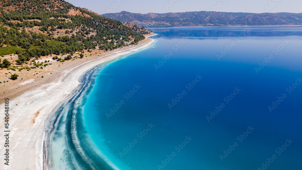 Lake Salda in Burdur, Turkey. High angle view of dried-up crater lake with water rich in magnesium. Turkey Maldives.