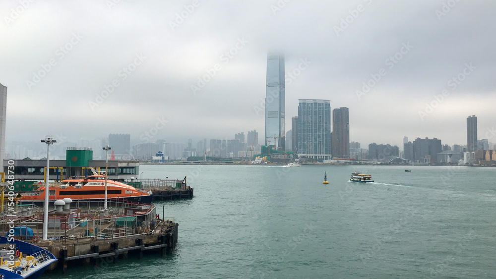 Hong Kong, China, November 2016 - A large body of water with a city in the background