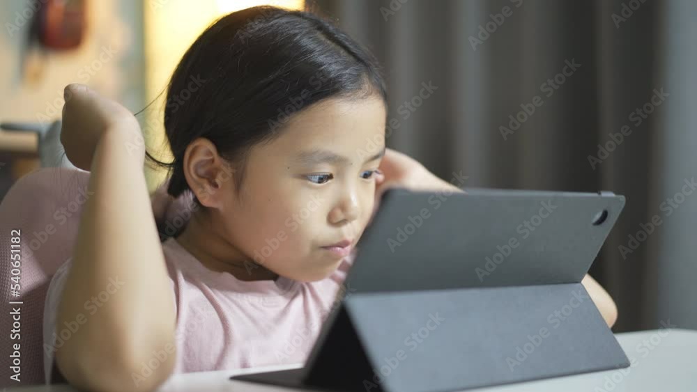 closeup asian child student enjoy studying online class on computer tablet or kid girl video call learning and smiling study talking or person learn from home school on pad by education technology closeup asian child student enjoy studying online class on computer tablet or kid girl video call learning and smiling study talking or person learn from home school on pad by education technology
