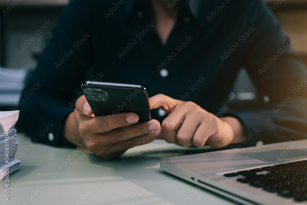 Hand using smart phone, mobile p payments online shopping, omni channel, digital tablet docking keyboard computer. Hand using smart phone, mobile p payments online shopping, omni channel, digital tablet docking keyboard computer.