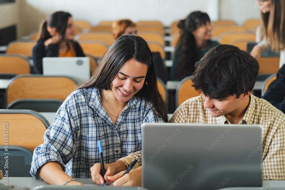 Young people studying inside university classroom - School education concept Young people studying inside university classroom - School education concept