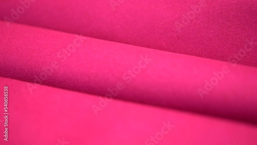 Close-up of a Pink Fabric Folded in Several Layers. Fuchsia Color photo