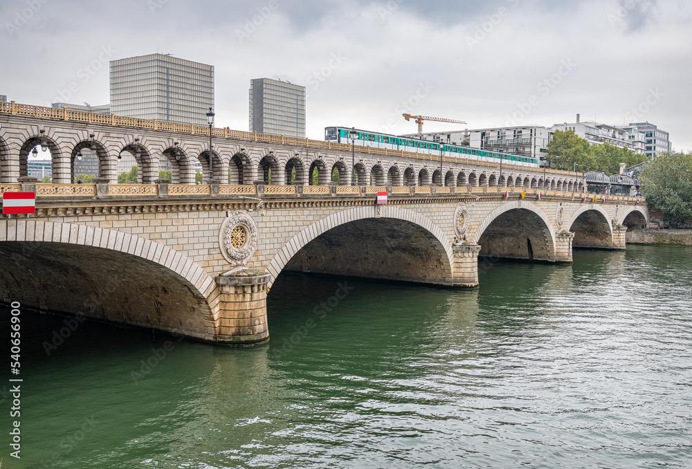 Pont de Bercy combined Road and Rail Bridge across River Seine with a train crossing, Paris France