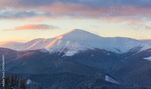 Amazing winter landscape with dramatic sky. Frosty morning in the highlands. Fantastic sunrise in Carpathian mountains, Ukraine, Europe. Christmas holiday concept. Perfect winter wallpaper.  © Oleksandr