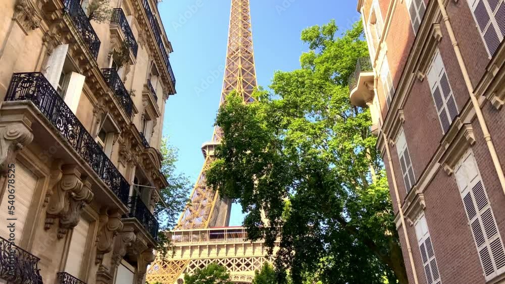Looking Up On Eiffel Tower From Parisian Street Between The Apartments In Paris, France. - dolly forward