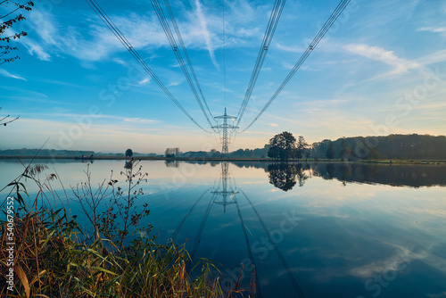Power line over lake in northern Germany. High quality photo