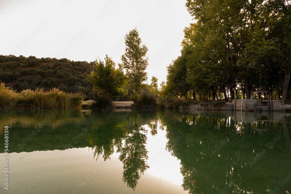 landscape with lake water with mountains, trees and bushes reflected in the dua with a sense of peace, relaxation and tourism landscape with lake water with mountains, trees and bushes reflected in the dua with a sense of peace, relaxation and tourism