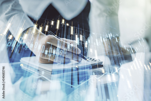 Multi exposure of abstract creative financial graph with hand writing in notepad on background, forex and investment concept