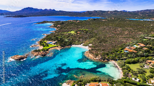 Fototapeta Naklejka Na Ścianę i Meble -  Italy summer holidyas . Sardegna island - stunning Emerald coast (Costa Smeralda) with beautiful beaches. aerial view of small Romazzino beach.