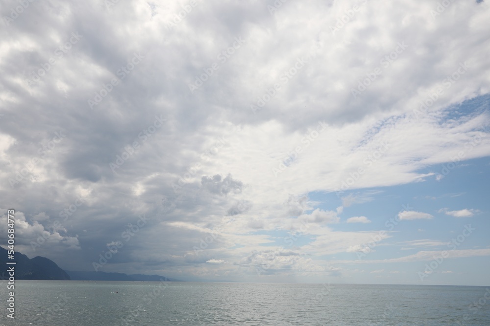 Picturesque view of beautiful sea under sky with clouds Picturesque view of beautiful sea under sky with clouds