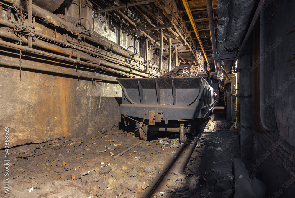 Freight wagon in the industrial workshop of an old factory Freight wagon in the industrial workshop of an old factory