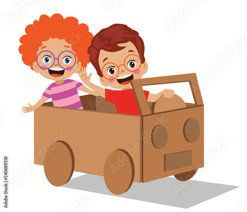 kids having fun with toy car out of cardboard box