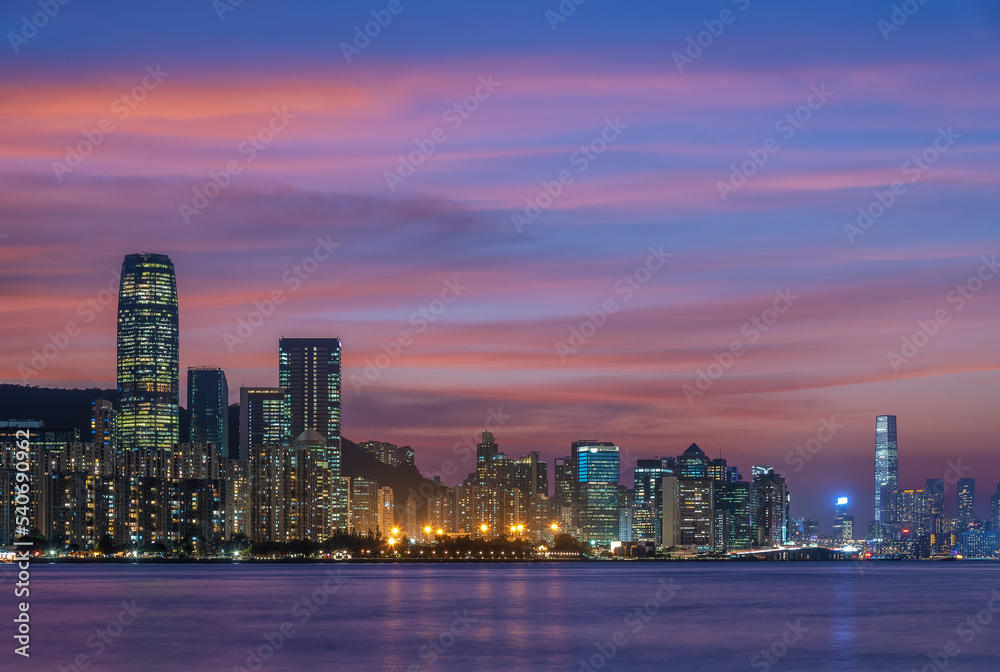 Skyline of Victoria Harbor in Hong Kong city at dusk Skyline of Victoria Harbor in Hong Kong city at dusk