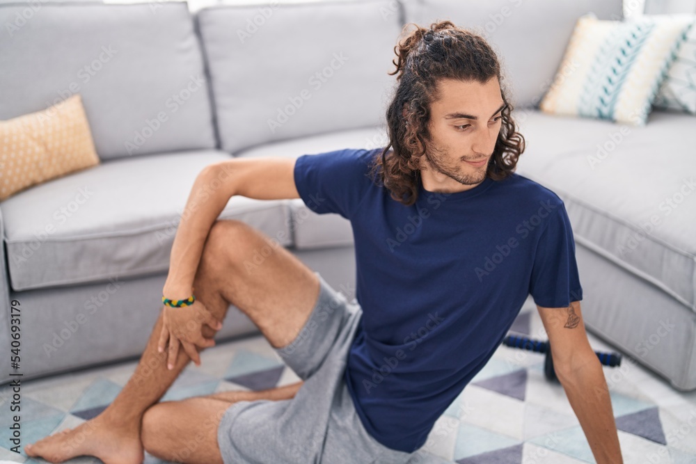 Young hispanic man doing yoga exercise at home Young hispanic man doing yoga exercise at home