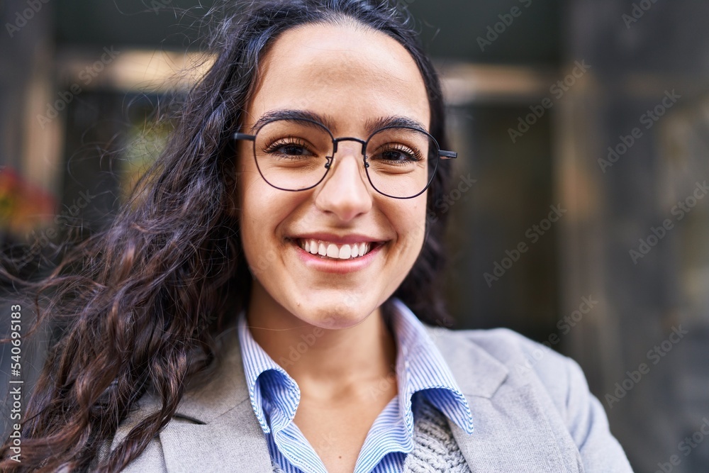 Young hispanic woman executive smiling confident at street Young hispanic woman executive smiling confident at street