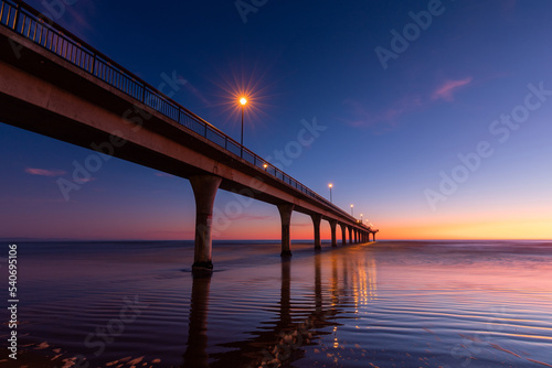 Scenic dawn view of New Brighton Pier, Christchurch, New Zealand.