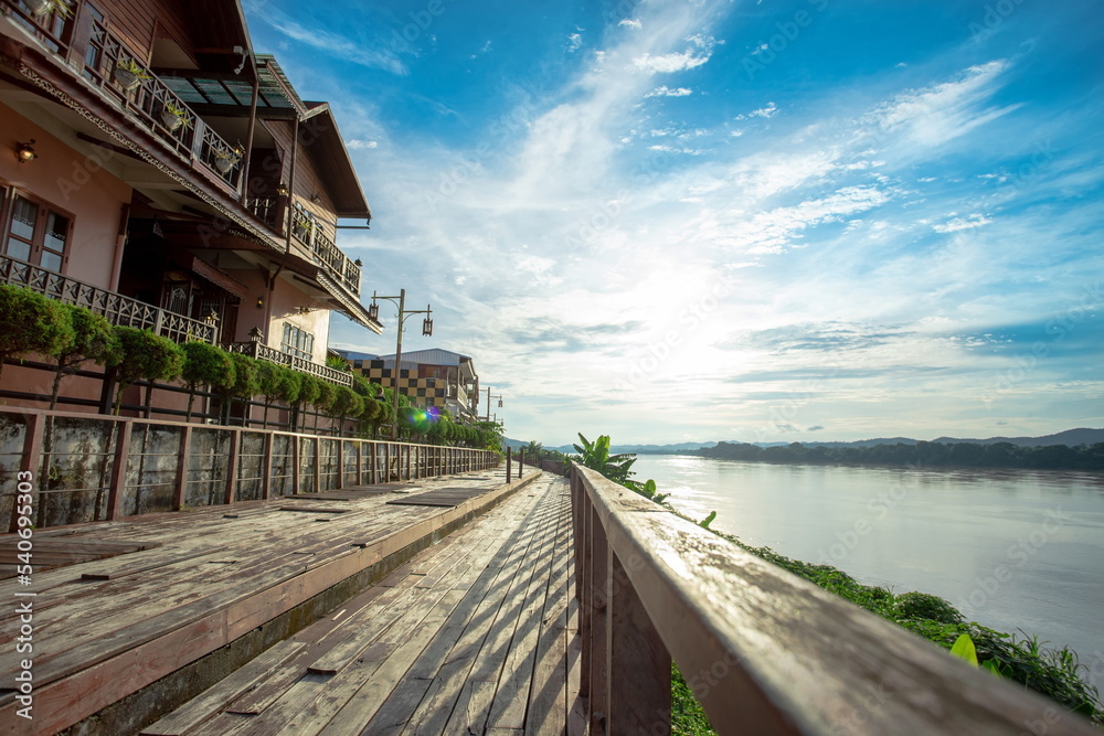 The scenery of the Mekong River and walkway with lens flair in Chiang Khan.