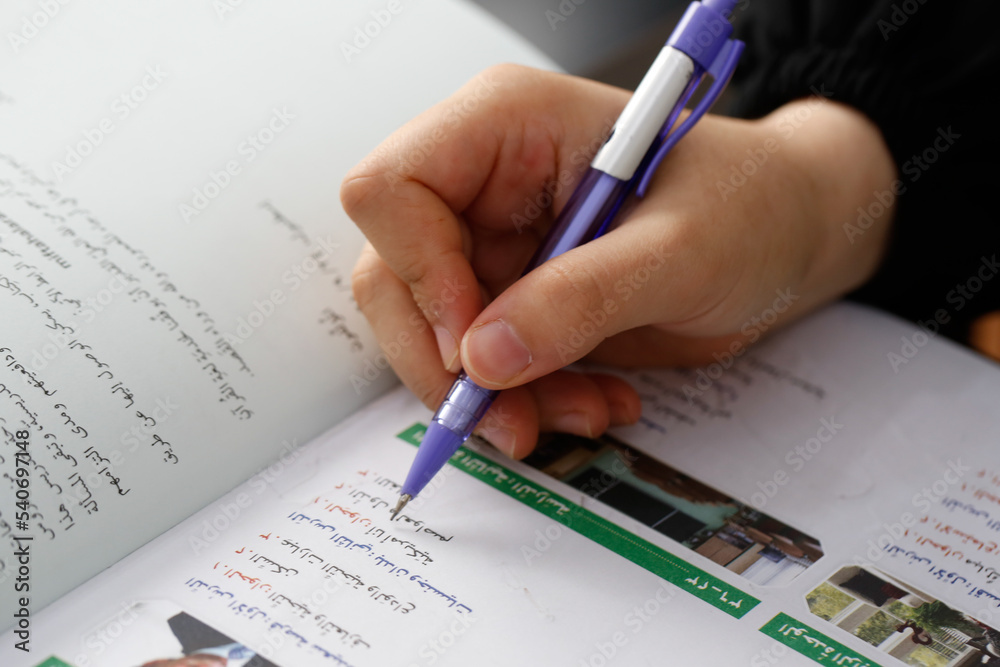 student taking notes in class student taking notes in class