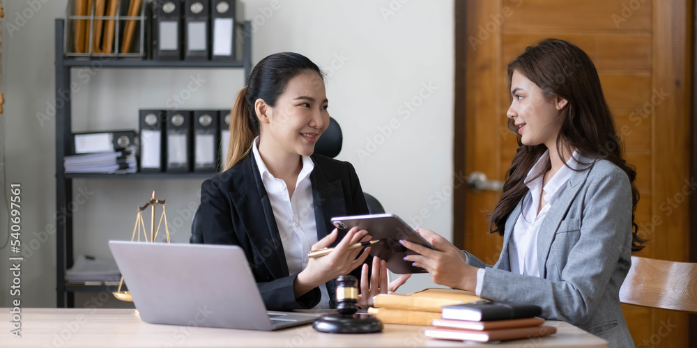 business people and lawyers discussing contract papers sitting at the table. Concepts of law, advice, legal services, legal and judgment concept business people and lawyers discussing contract papers sitting at the table. Concepts of law, advice, legal services, legal and judgment concept
