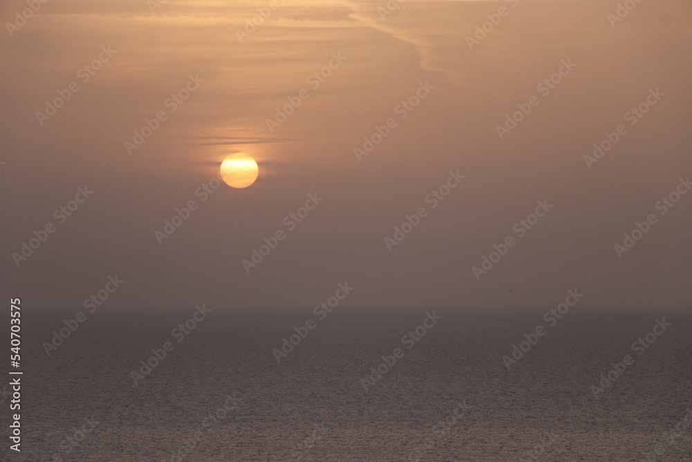 sunrise among clouds over the mediterranean sea 