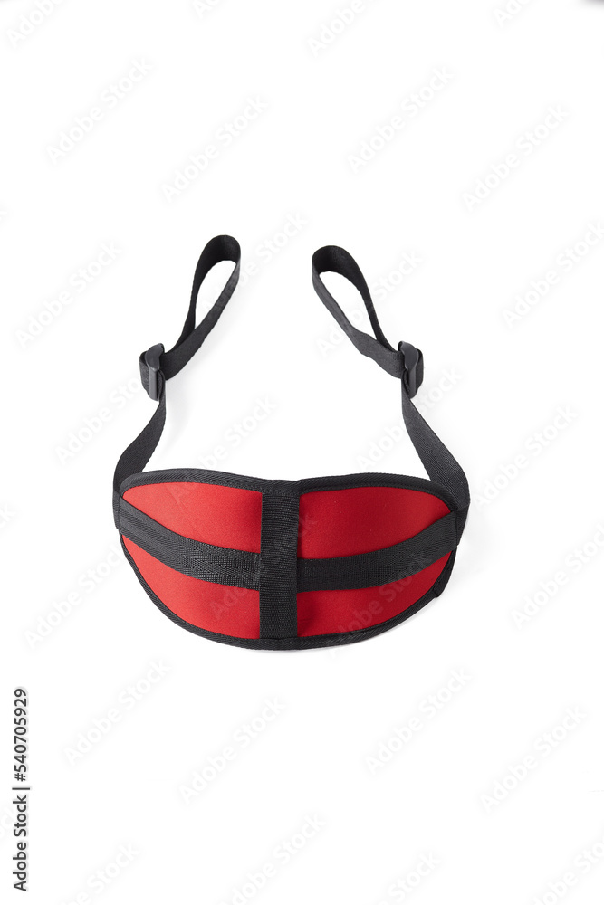 Close-up shot of a red and black fabric doggie style strap padded. An adjustable strap for couples is isolated on a white background. Front view.