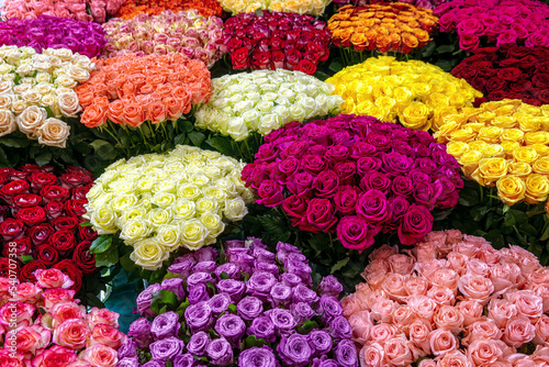 Fototapeta Naklejka Na Ścianę i Meble -  Flower background top view. Multicolored bouquets of roses sale in flower shop.