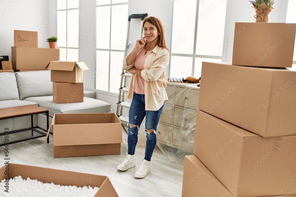 Middle age caucasian woman smiling happy standing at new home. Middle age caucasian woman smiling happy standing at new home.
