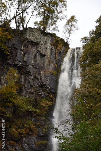 the tall Pistyll Rhaeadr waterfall in north wales from the bottom of it