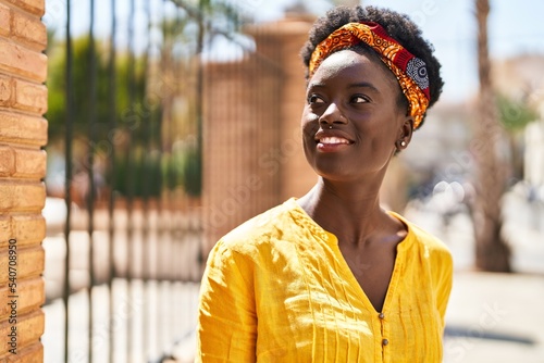 Young african american woman smiling confident standing at street