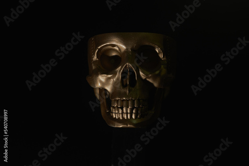 Gold human Skull Isolated on black background