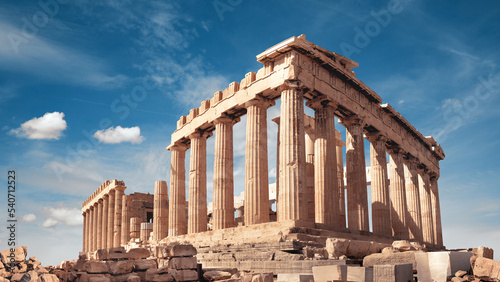 Parthenon temple in Acropolis in Athens, Greece. Panoramic image on a bright sunny day, blue sky with clouds. photo