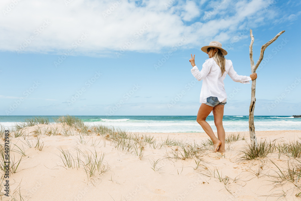 Woman on pristine seculuded beach Australia good vibes Woman on pristine seculuded beach Australia good vibes