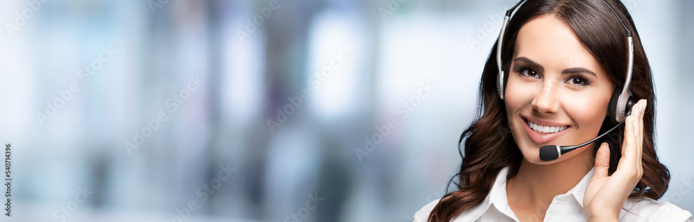 Call Center Service. Beautiful customer support or sales agent. Caller or receptionist phone operator. Helping, answering, consulting. Blurred office background. Call Center Service. Beautiful customer support or sales agent. Caller or receptionist phone operator. Helping, answering, consulting. Blurred office background.