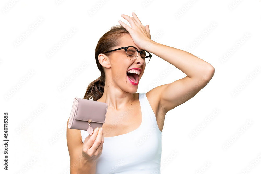 Young caucasian woman holding a wallet over isolated background has realized something and intending the solution Young caucasian woman holding a wallet over isolated background has realized something and intending the solution