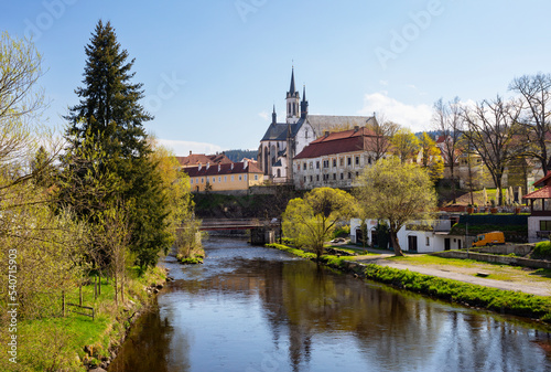 Czech Republic, South Bohemian Region, Vyssi Brod, Vltava river canal withHohenfurth Abbeyin background photo