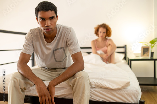Couple having a conflict and looking upset and stressed